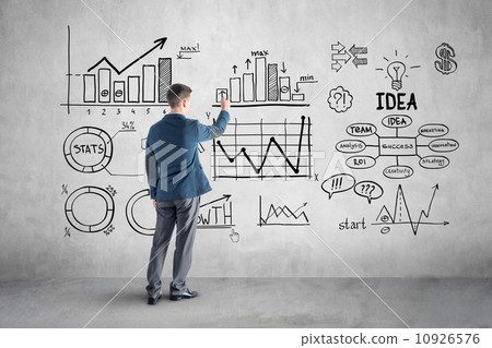 businessman drawing  business plan, graph, chart on wall 10926576