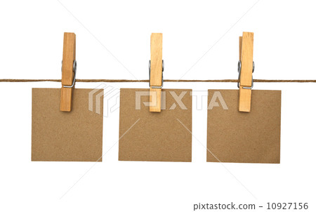 close up of a notes and a clothes pegs on white background close up of a notes and a clothes pegs on white background 10927156