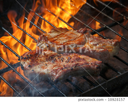 A top sirloin steak flame broiled on a barbecue, shallow depth o 10928157