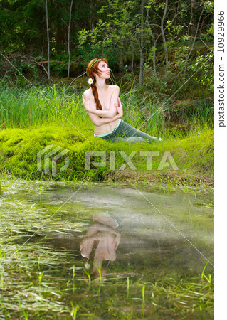 The girl-witch in dense wood on the bank of wood lake The girl-witch in dense wood on the bank of wood lake 10929966