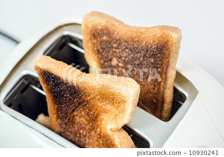 Close up of   Burnt Toast  in Toaster (With Path) 10930241