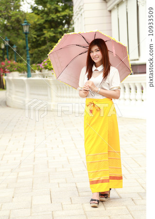 Thai girl dressing and umbrella with traditional style Thai girl dressing and umbrella with traditional style 10933509