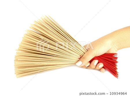 hand holding incense on white background 10934964