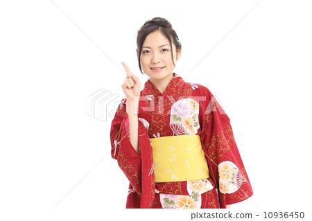 A woman wearing a yukata pointing her finger 10936450