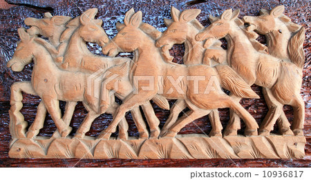 Beautiful sculpture of horse made of only one peace of wood 10936817