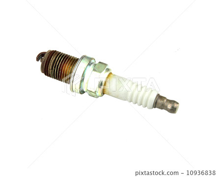 old burned spark plug on white background 10936838