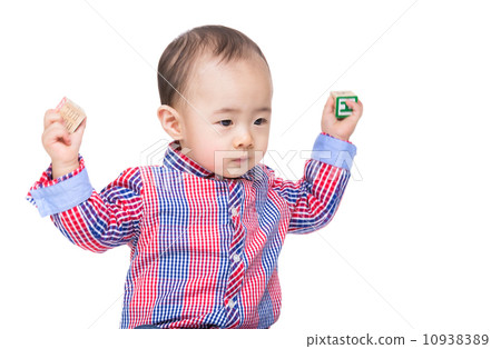 Asia baby boy throwing toy block Asia baby boy throwing toy block 10938389