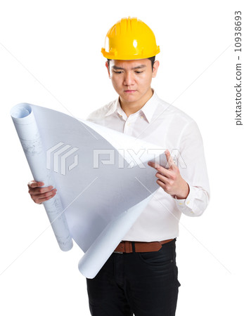 Engineer looking at blueprint 10938693