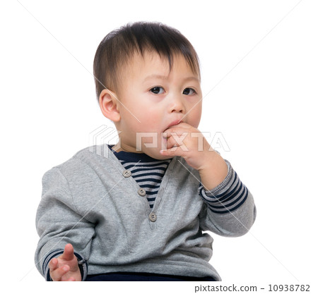 Little boy biting his finger 10938782