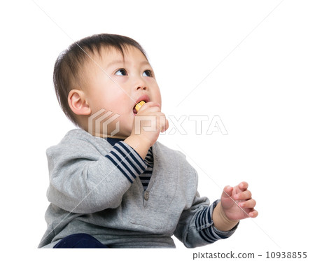 Baby boy eating snack Baby boy eating snack 10938855