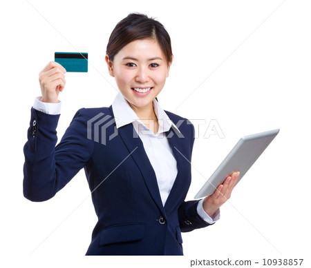 Businesswoman with tablet and showing credit card Businesswoman with tablet and showing credit card 10938857