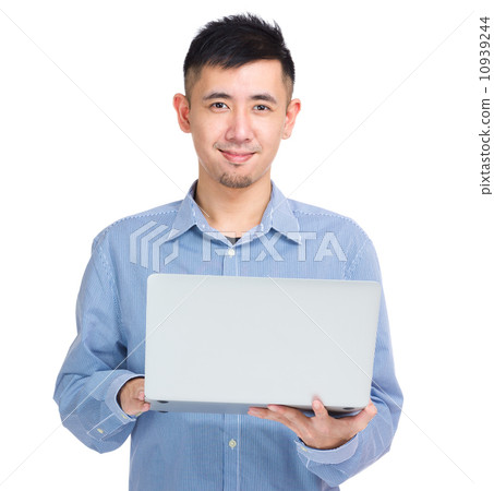 Young asian man holding laptop computer 10939244