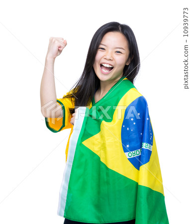 Excited asia woman draped with Brazil flag Excited asia woman draped with Brazil flag 10939773