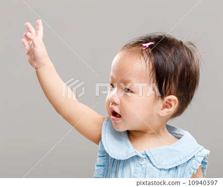 Little girl raise her hand up Little girl raise her hand up 10940397