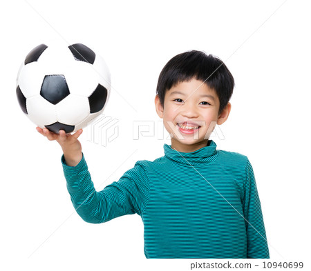 Young boy holding soccer ball 10940699