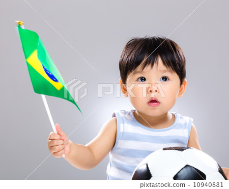 Baby son holding flag amd soccer ball 10940881