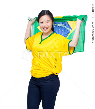 Asia female soccer fans holding Brazil flag Asia female soccer fans holding Brazil flag 10940994