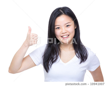 Young asian woman showing thumb up Young asian woman showing thumb up 10941007