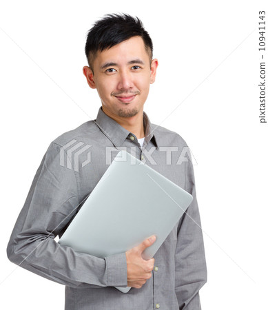 Confident young man holding laptop 10941143