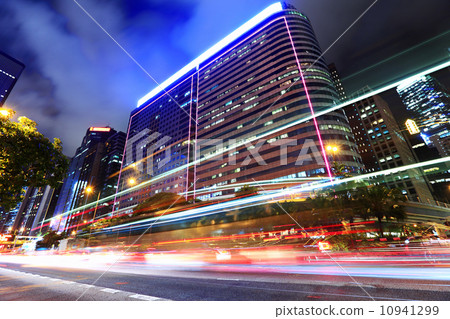 Car light through city at night Car light through city at night 10941299