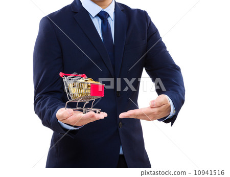 Businessman putting coin into trolley 10941516