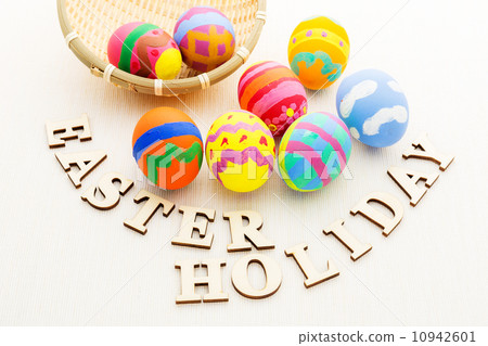Painted easter egg in basket with wooden text Painted easter egg in basket with wooden text 10942601