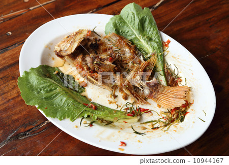 eaten Fried ruby fish topped with sweet,sauer and hot sauce eaten Fried ruby fish topped with sweet,sauer and hot sauce 10944167