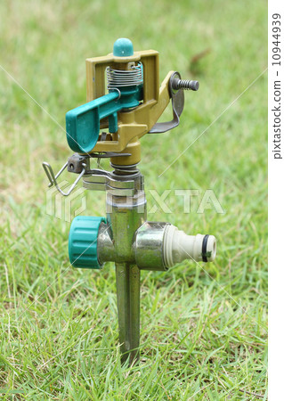 sprinkler on the green grass sprinkler on the green grass 10944939