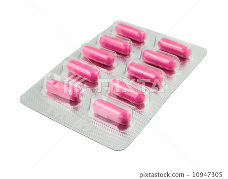 Pink pills pack on white 10947305
