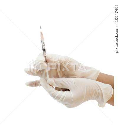hand holding syringe isolated on white background hand holding syringe isolated on white background 10947495