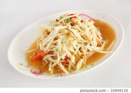 papaya salad on white table papaya salad on white table 10949138