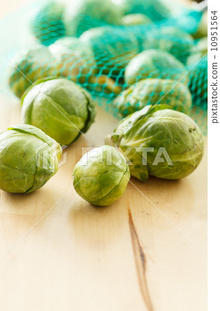 Brussels sprouts cabbage on old wooden table Brussels sprouts cabbage on old wooden table 10951564