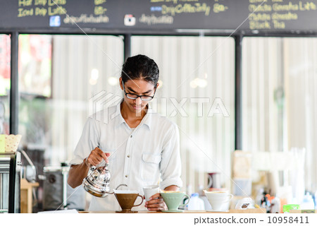 Barista brews a single cup a coffee house employee brew a single 10958411
