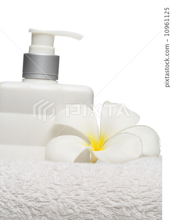 square bottle soap and flower on white towel white background  10961125