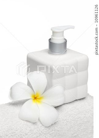 square bottle soap and flower on white towel white background square bottle soap and flower on white towel white background 10961126