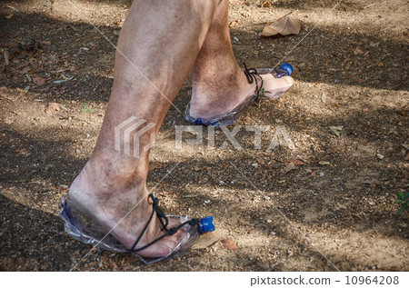 Troglodyte going in plastic bottle shoes Troglodyte going in plastic bottle shoes 10964208