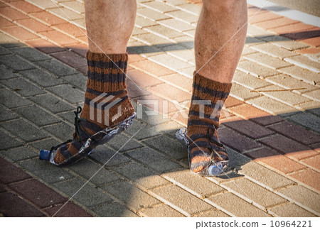Homeless showing new knitted socks 10964221