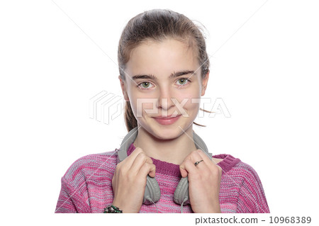 happy teenager girl with headphones, isolated on white 10968389