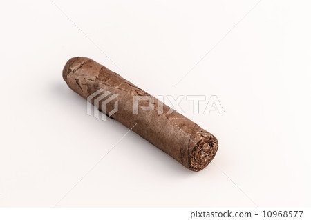 Expensive hand-rolled cigar on a while background Expensive hand-rolled cigar on a while background 10968577