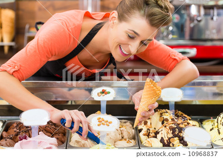 Female seller in Parlor with ice cream cone 10968837