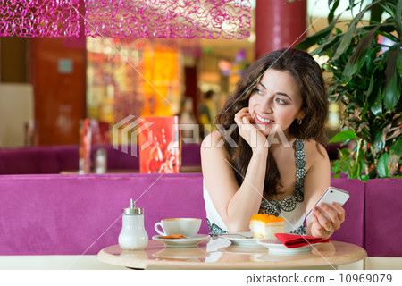 Young woman in ice cream parlor Young woman in ice cream parlor 10969079