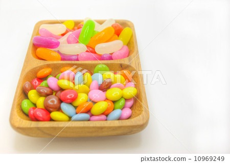 Colorful grain chocolate and sugar confectionery packed in tree vessels 10969249