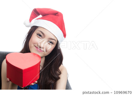 Young women wearing Christmas hats 10969670