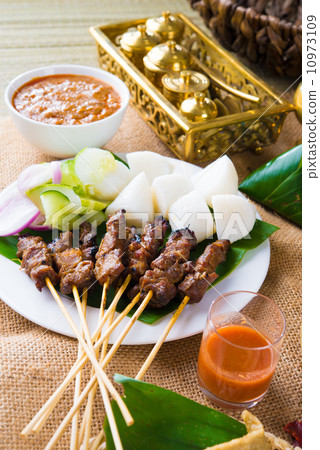 beef satay with traditional background setting beef satay with traditional background setting 10973109