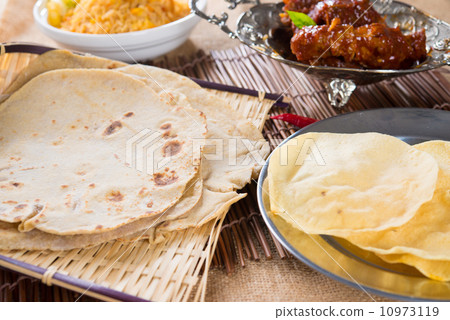 Chapati or Flat bread, roti canai, Indian food, made from wheat Chapati or Flat bread, roti canai, Indian food, made from wheat 10973119