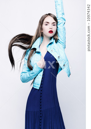 Portrait of a young woman in a blue dress. 10974342