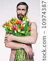 Men portrait with a bouquet of flowers. 10974387
