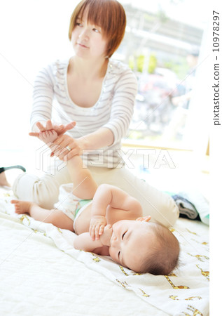 Baby receiving a baby massage Baby receiving a baby massage 10978297