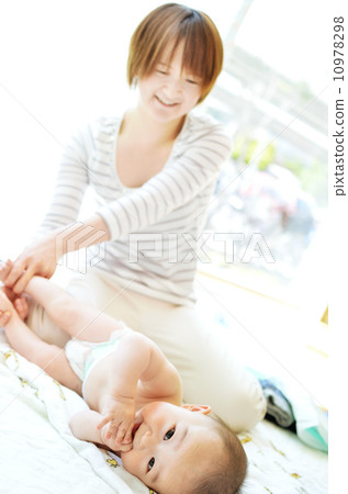 Baby receiving a baby massage Baby receiving a baby massage 10978298