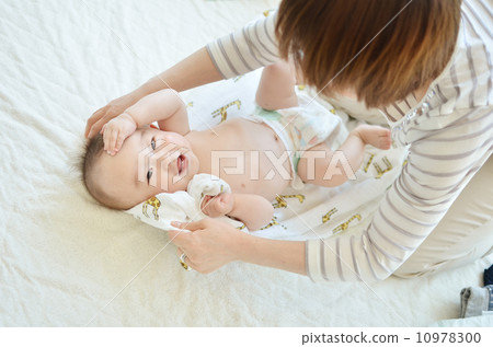 Baby receiving a baby massage 10978300